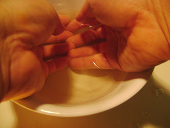 Dipping fingers in vinegared water