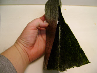 Bending the sheet the other way to help break the nori...