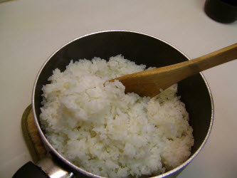 Fluff the rice after 20 minutes of "steaming" with the lid on and then replace the lid again and wait another 5 minutes.