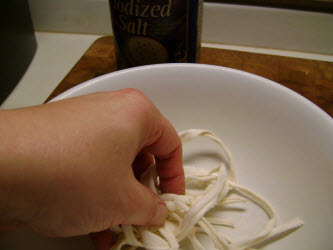 Kneading kampyo gourd strips vigorously with salt