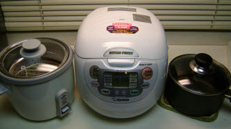 From left to right: Standard 1 button rice cooker, fancy rice cooker, and a pot