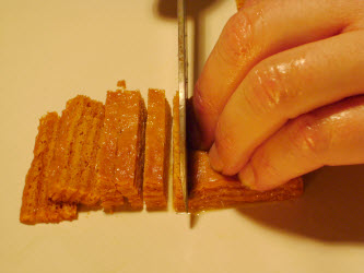 Stack and slice inarizushi-no-moto into 1/8 inch strips