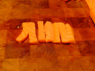 Sliced cold smoked salmon around 3/8 inch for maki sushi