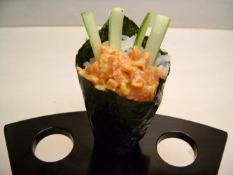 Spicy tuna hand roll in a hand roll stand