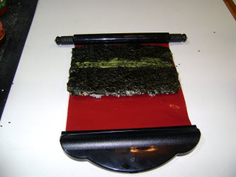 Flipped the nori and rice over on the sushi magic mat and added a swipe of wasabi