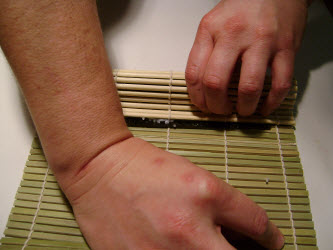 Also tighten the roll on the left and right hand ends by holding with the left hand and tugging with the right hand...