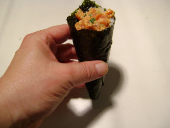 Spicy tuna hand roll ready to eat. But eat it quickly before the crispy nori gets soft!