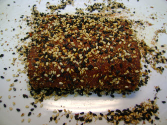 Tuna with black and white sesame seeds pressed into the flesh