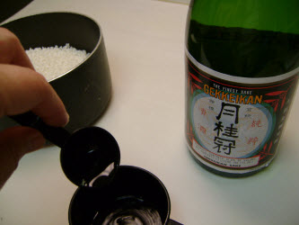 Add 2 tablespoons sake to 2 cup measuring cup and fill remaining with bottled water