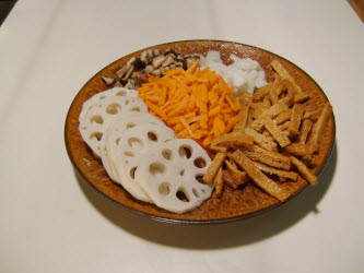 All the uncooked ingredients: Lotus root, carrots, shitake, kampyo gourd strips and inarizushi-no-moto