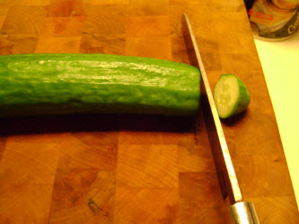 Cutting end off of English cucumber to salt scrub it