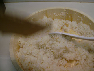Immediately start fanning the hot rice and sushi seasoning constantly turning the rice over and mixing it...don't stop until all of the liquid is absorbed, each grain is shiny and rice fluffy
