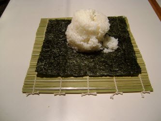 1 and 1/2 cups of sushi rice on nori sheet for futomaki
