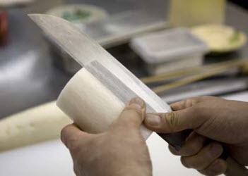 Slicing thin sheets off of vegetables for Katsomuki