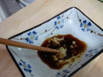 Mixing wasabi in soy sauce