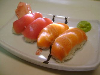 Salmon and Tuna Nigiri sushi on white sushi plate