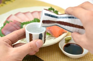 Pouring sake into a cup