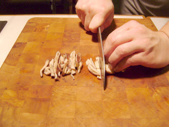 Cutting up shitake mushrooms for futomaki