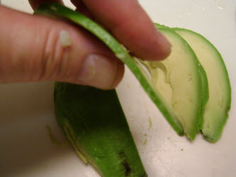 Showing how thin the avocado is sliced