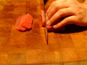 Cutting 1/4 inch slabs off of sushi grade tuna block using straight cut