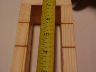 Measuring length of oshibako showing it is 7 inches long inside measurements