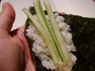 You can add some veggies like slivered cucumber or avocado to your spicy tuna hand roll