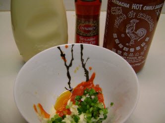 Unmixed ingredients for spicy tuna sauce. Mayonaisse, hot sesame oil, Sriracha Hot Chili Sauce, and green onions