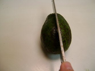 Slicing avocado in half