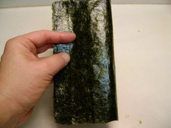 Bend nori sheet in half on 8 inch side