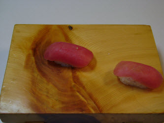 Here are two tuna nigiri just like they dropped out of the mold